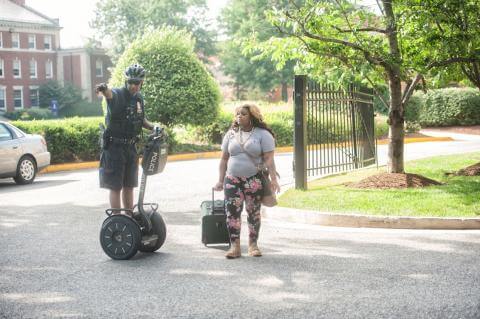 Campus Police helping a student with directions